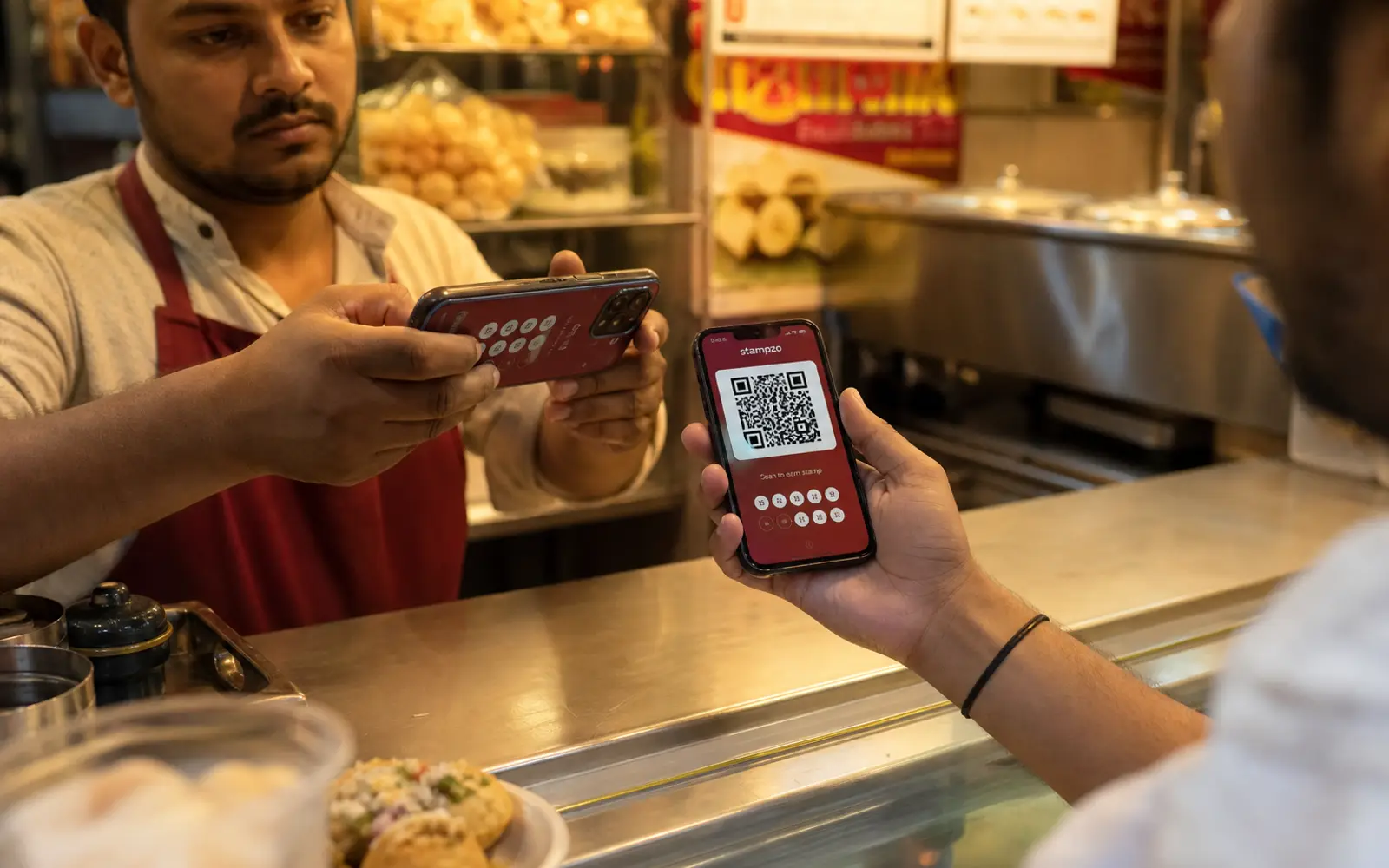 Staff scanning the QR on the customer phone